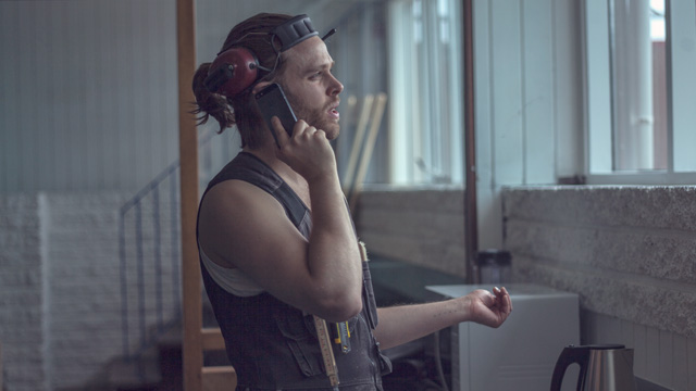 Construction worker looking through the window - Small