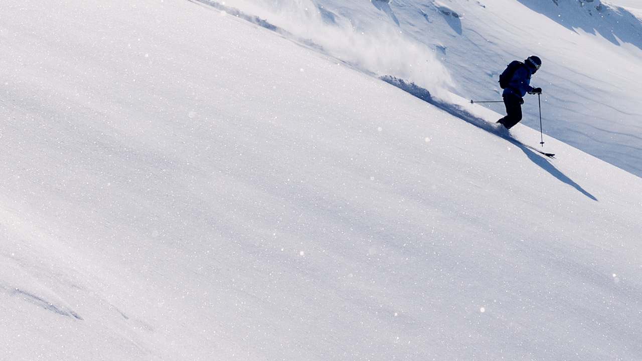 A person skiing down the hill