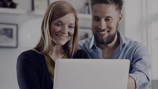 young couple looking at laptop 2 small overlay